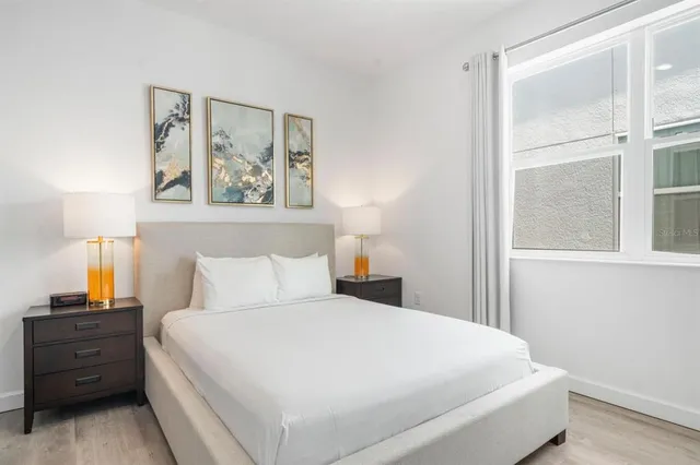 a bedroom with a bed and a dresser