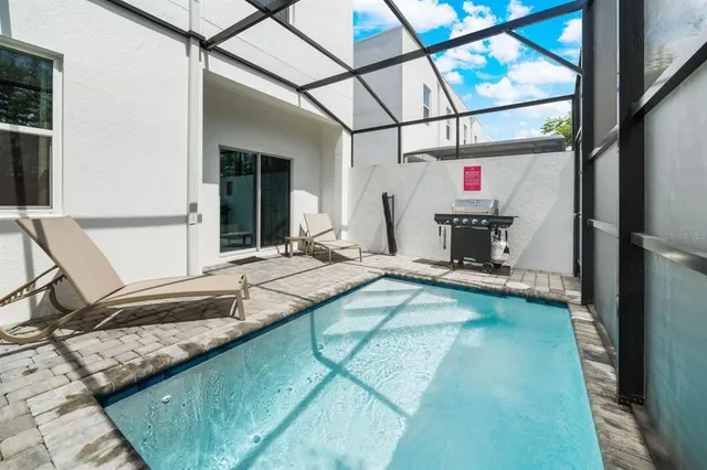 a living room with a bed and a table