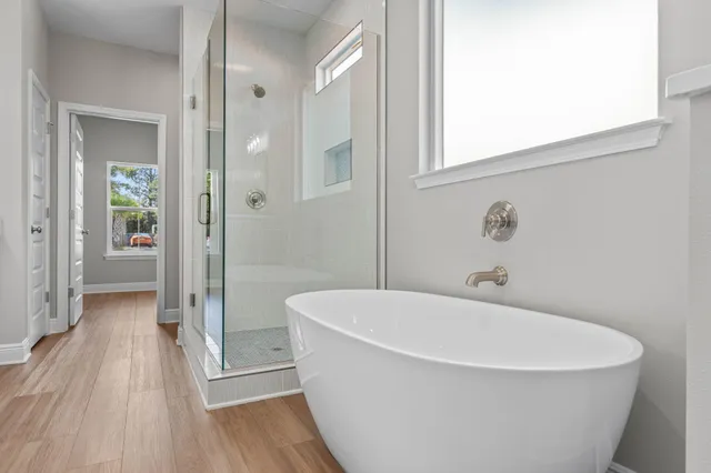 a white bath tub sitting in a bathroom