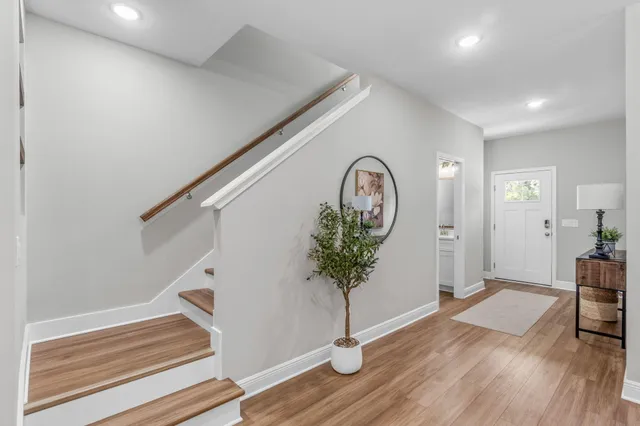 a view of entryway with wooden floor