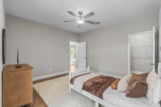 a bedroom with bed and a window