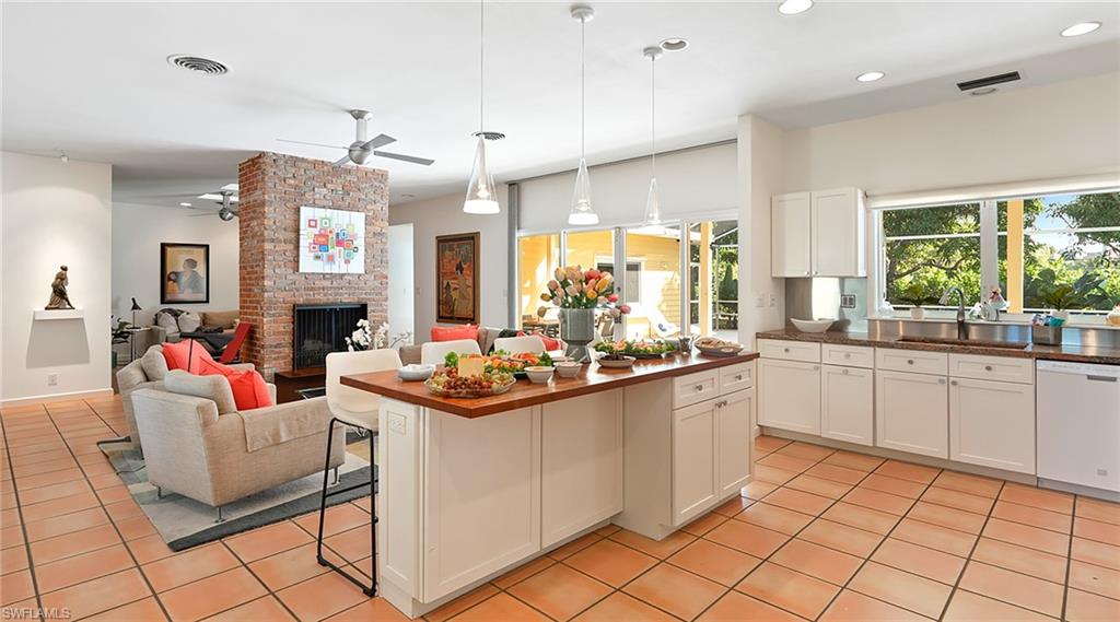586 Yucca Road Naples, FL 34102 - Photo 9 of 26 Kitchen featuring pendant lighting, a kitchen breakfast bar, dishwasher, plenty of natural light, and recessed lighting