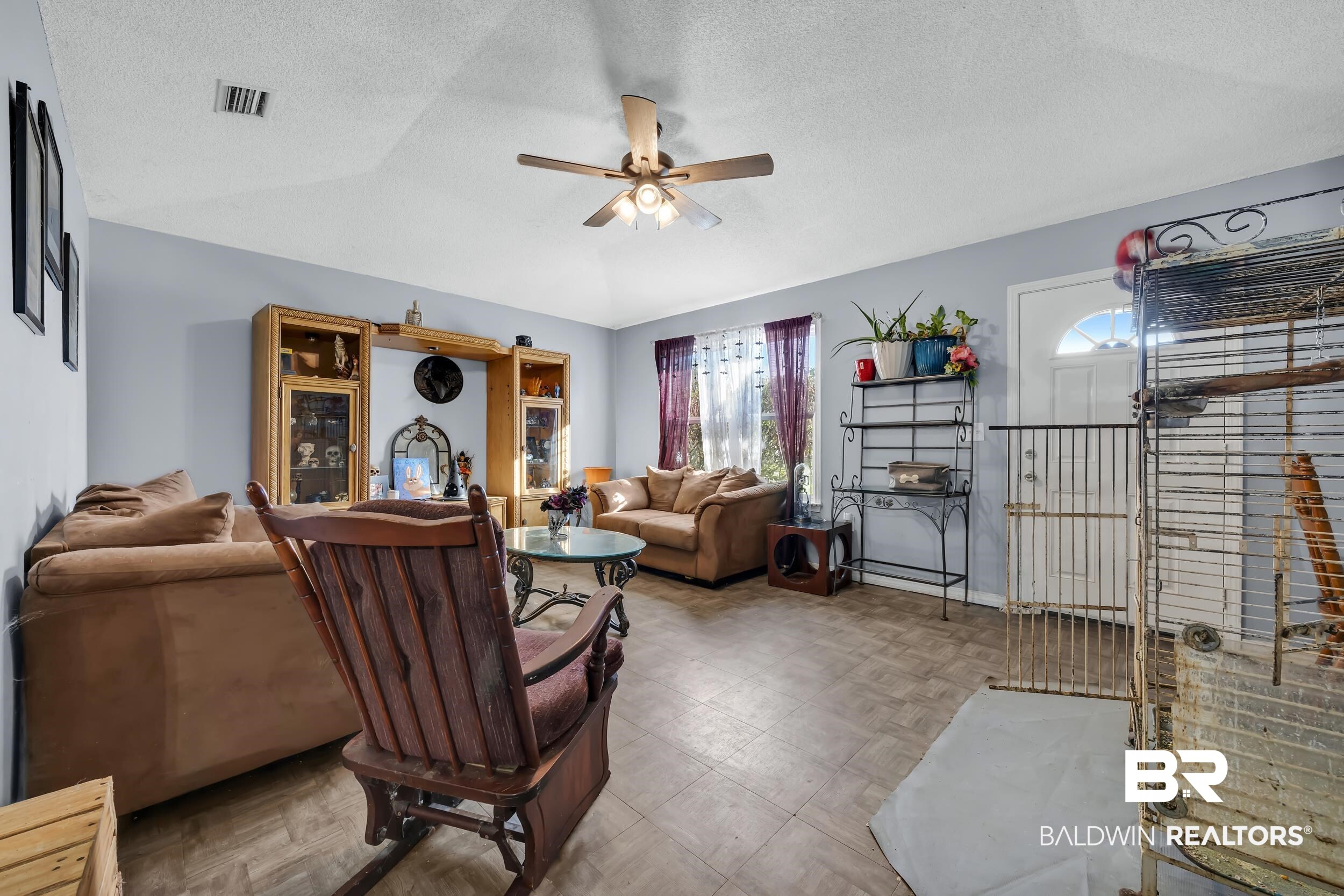 16603 Vanilla Drive Foley, AL 36535 - Photo 4 of 19 Living room with a textured ceiling, a ceiling fan, lofted ceiling, and tile patterned floors