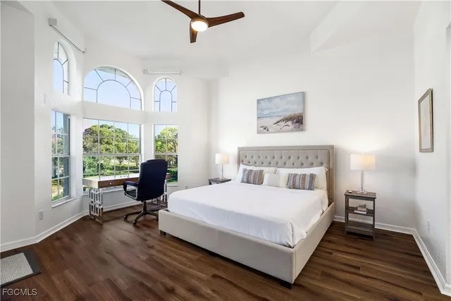 a bedroom with a bed a table and chair