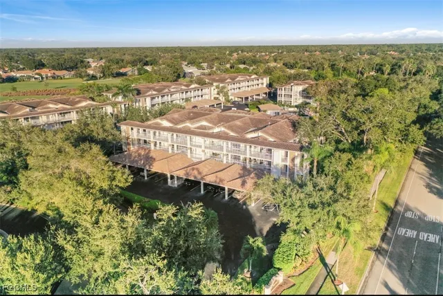 an aerial view of a house yard swimming pool and outdoor seating