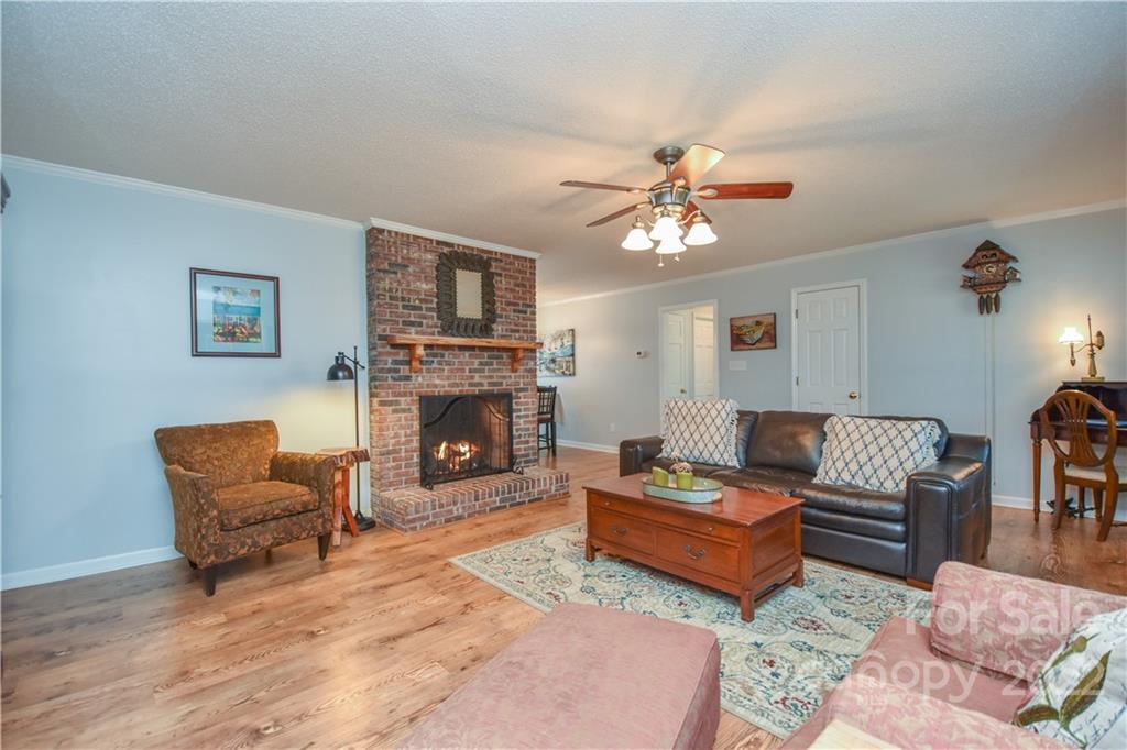 3403 Lake Shore Road South Denver, NC 28037 - Photo 1 of 37 a living room with furniture and a fireplace