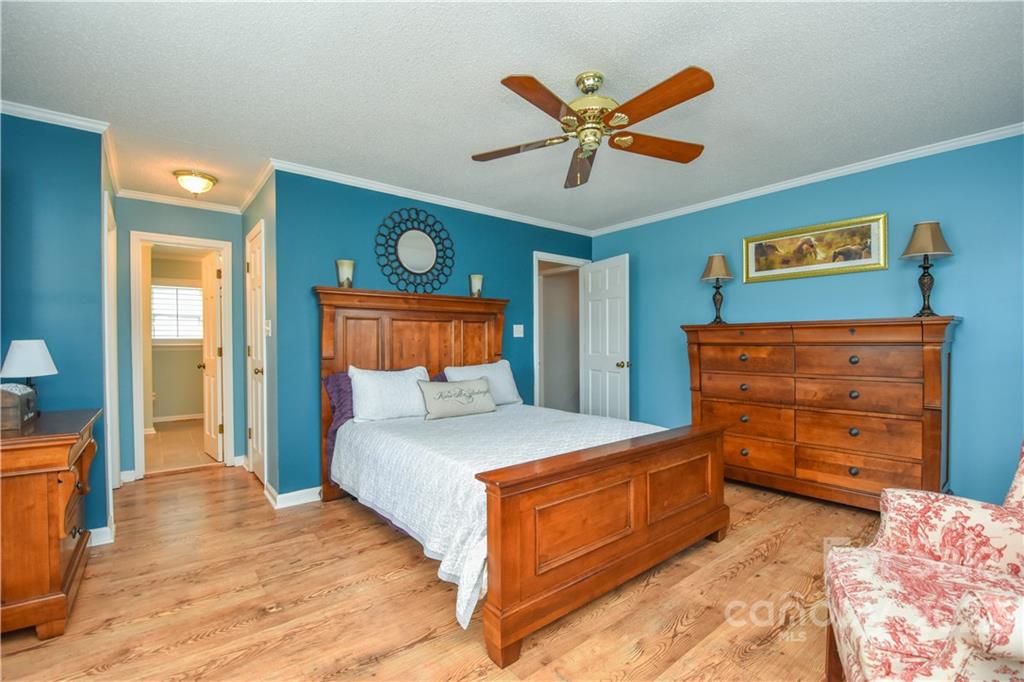 3403 Lake Shore Road South Denver, NC 28037 - Photo 14 of 37 a bedroom with a bed and a dresser
