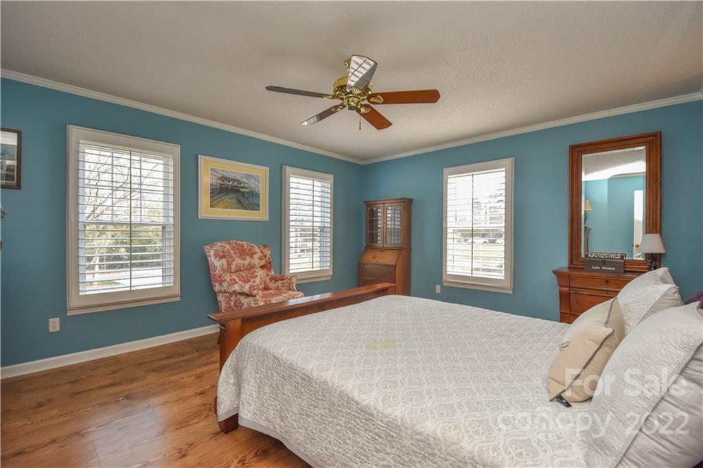 3403 Lake Shore Road South Denver, NC 28037 - Photo 16 of 37 a bedroom with a bed and a large window