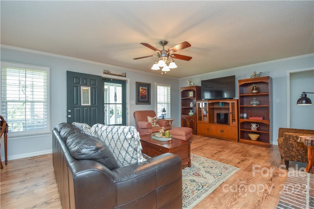 3403 Lake Shore Road South Denver, NC 28037 - Photo 2 of 37 a living room with furniture and a flat screen tv