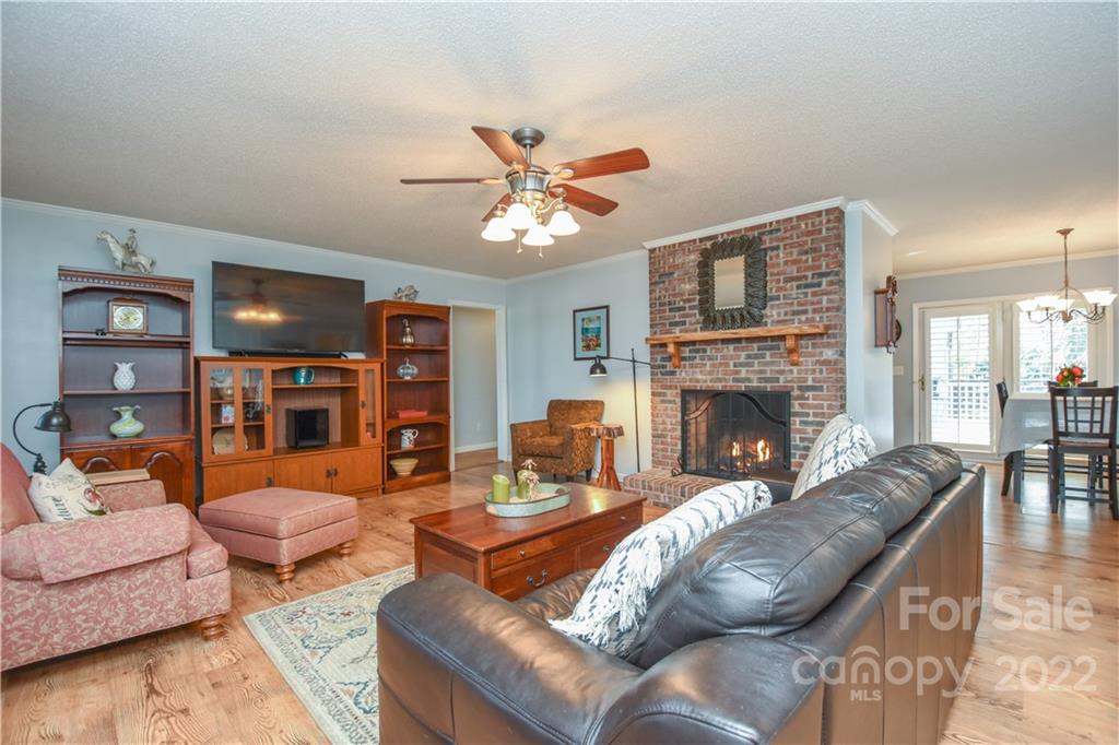 3403 Lake Shore Road South Denver, NC 28037 - Photo 3 of 37 a living room with furniture fireplace and a flat screen tv