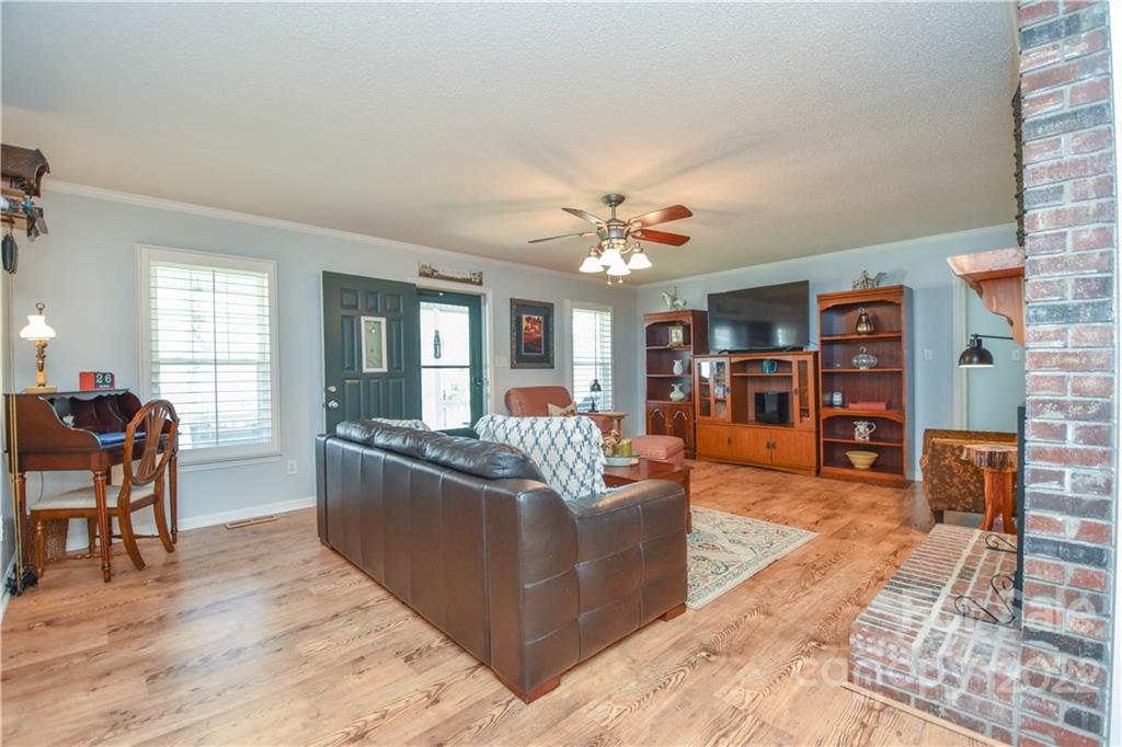 3403 Lake Shore Road South Denver, NC 28037 - Photo 4 of 37 a living room with furniture and wooden floor