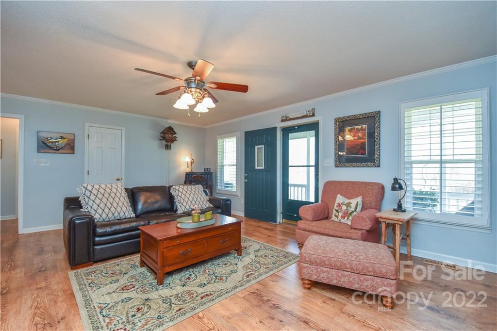 3403 Lake Shore Road South Denver, NC 28037 - Photo 6 of 37 a living room with furniture and a large window