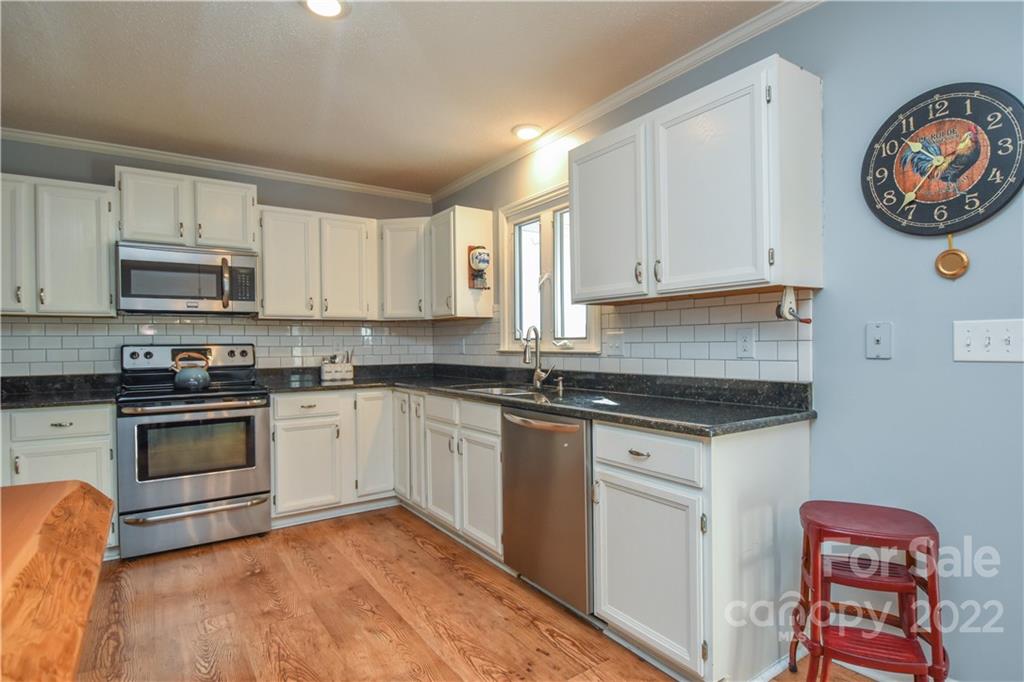 3403 Lake Shore Road South Denver, NC 28037 - Photo 8 of 37 a kitchen with stainless steel appliances granite countertop a stove and a sink