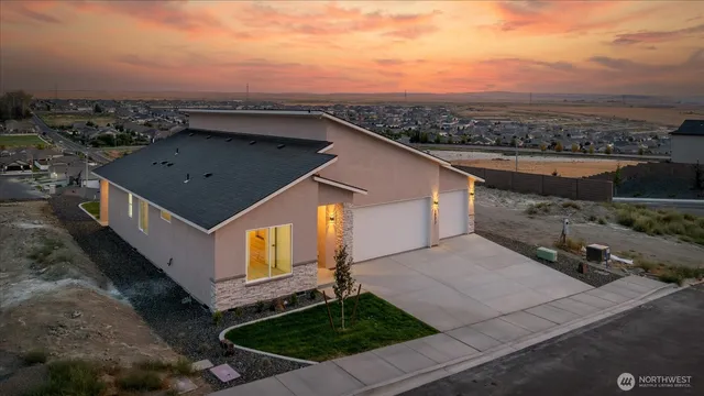 a house that has a toilet in front of it