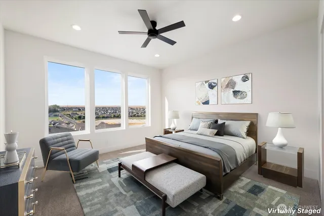 a bedroom with a bed a couch and a window