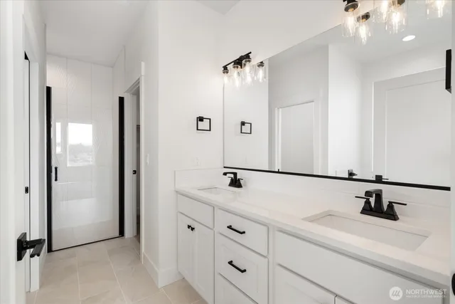 a bathroom with a sink and mirror