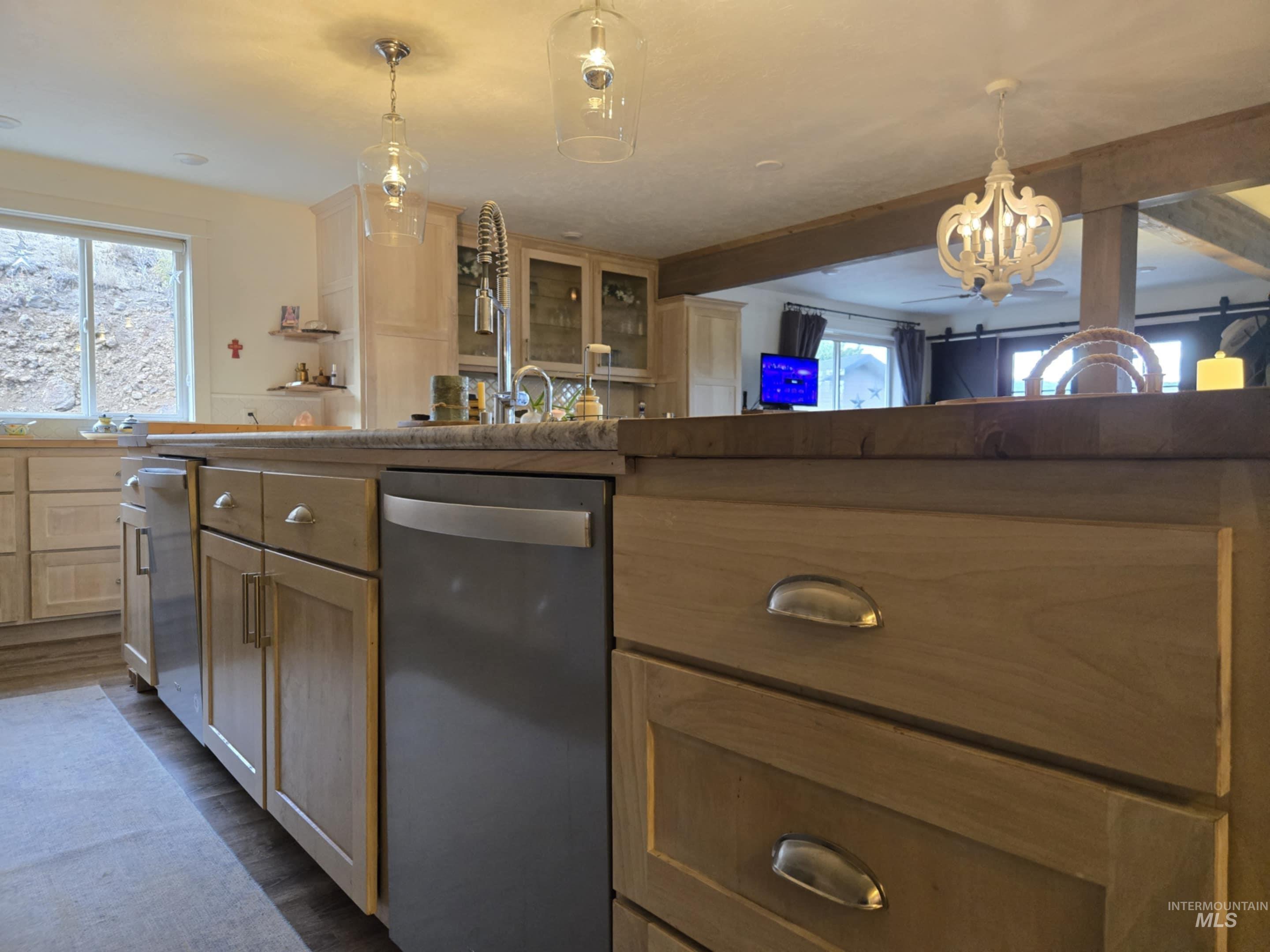 2141 Jackson Creek Road Council, ID 83612 - Photo 10 of 45 The oversized island does more than anchor the kitchen it houses two dishwashers, incredible storage, and plenty of room on the other side for your favorite people