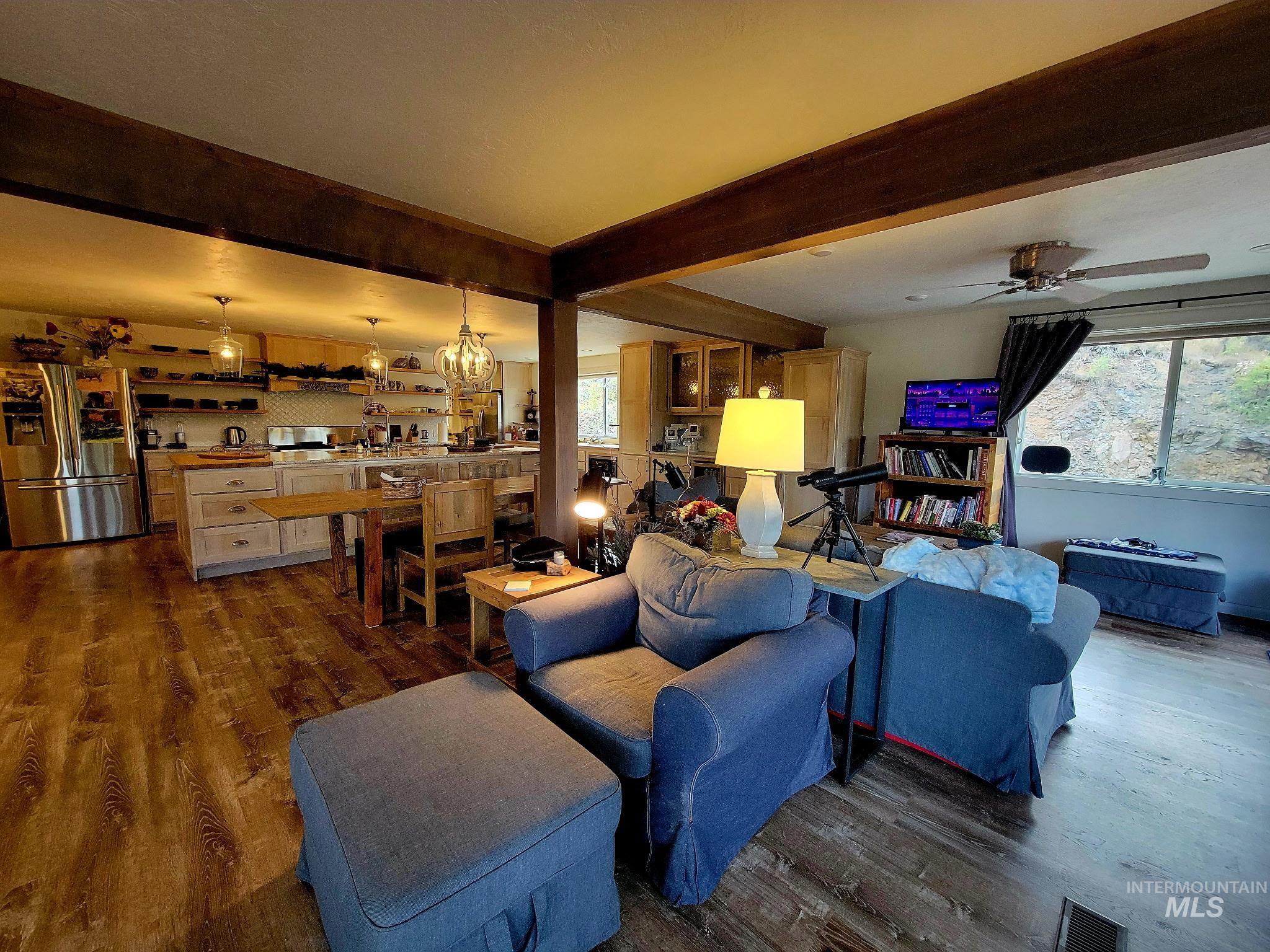 2141 Jackson Creek Road Council, ID 83612 - Photo 13 of 45 The living area is accented by a beam ceiling and furnished with IKEA pieces known for their durability and easy-to-swap covers—perfect when you’re ready for a fresh look