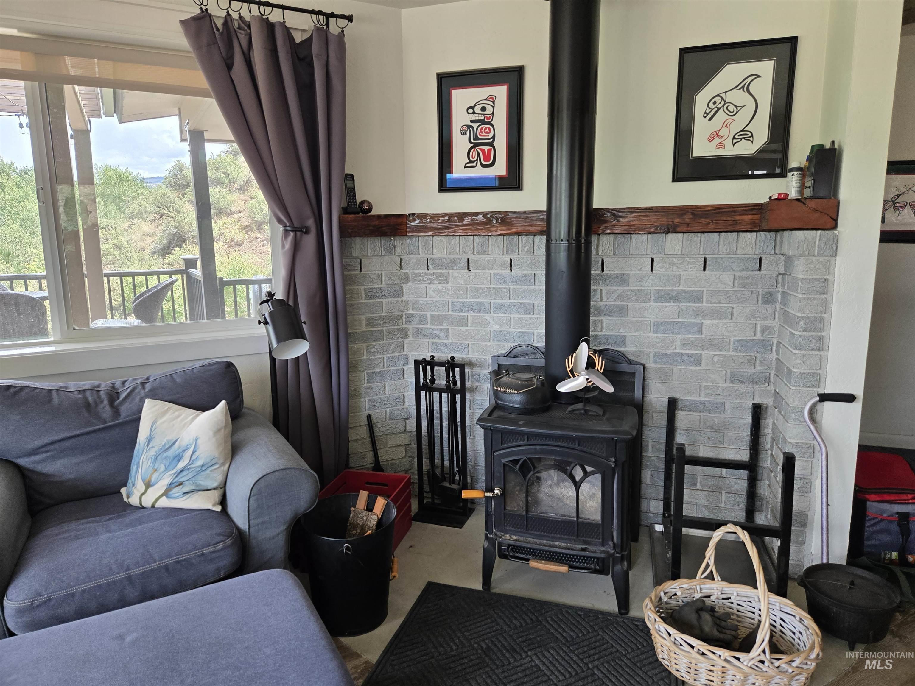 2141 Jackson Creek Road Council, ID 83612 - Photo 17 of 45 A wood stove adds both practicality and atmosphere to the living area