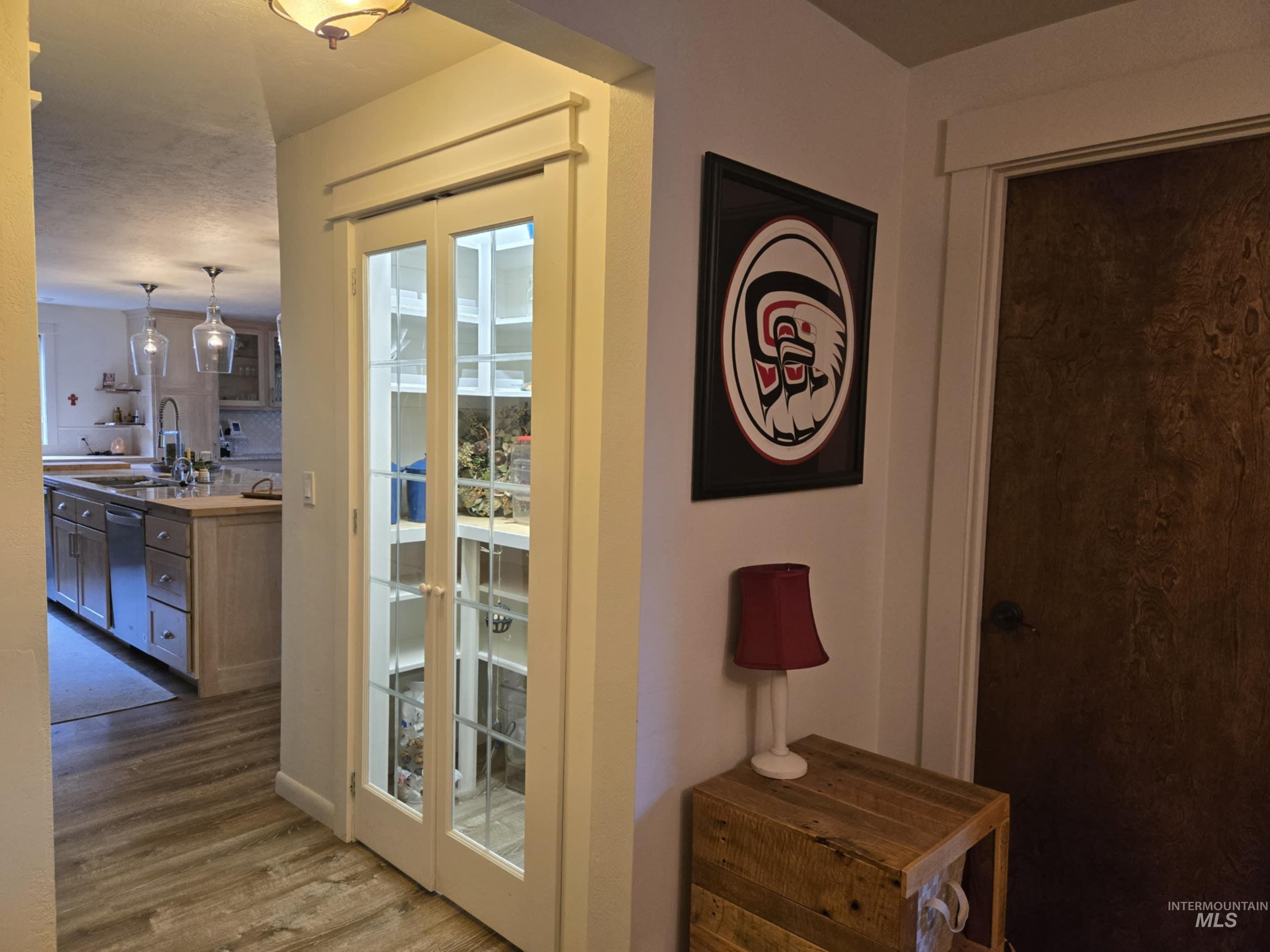 2141 Jackson Creek Road Council, ID 83612 - Photo 19 of 45 A lighted pantry with glass French doors adds both style and function, keeping everything organized and beautifully displayed