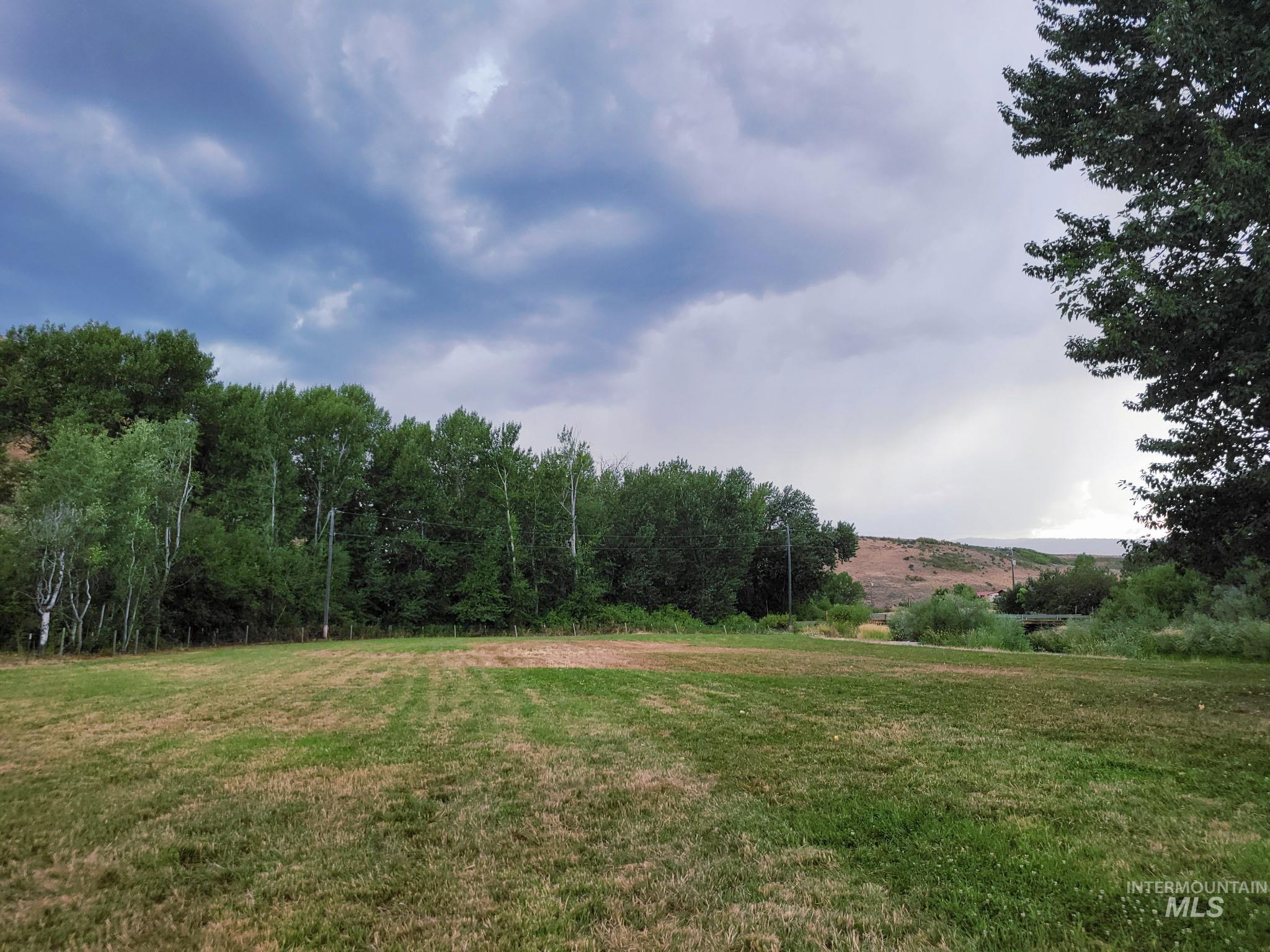 2141 Jackson Creek Road Council, ID 83612 - Photo 32 of 45 With room to spread out and views to enjoy, the riverfront field is made for reunions and special celebrations