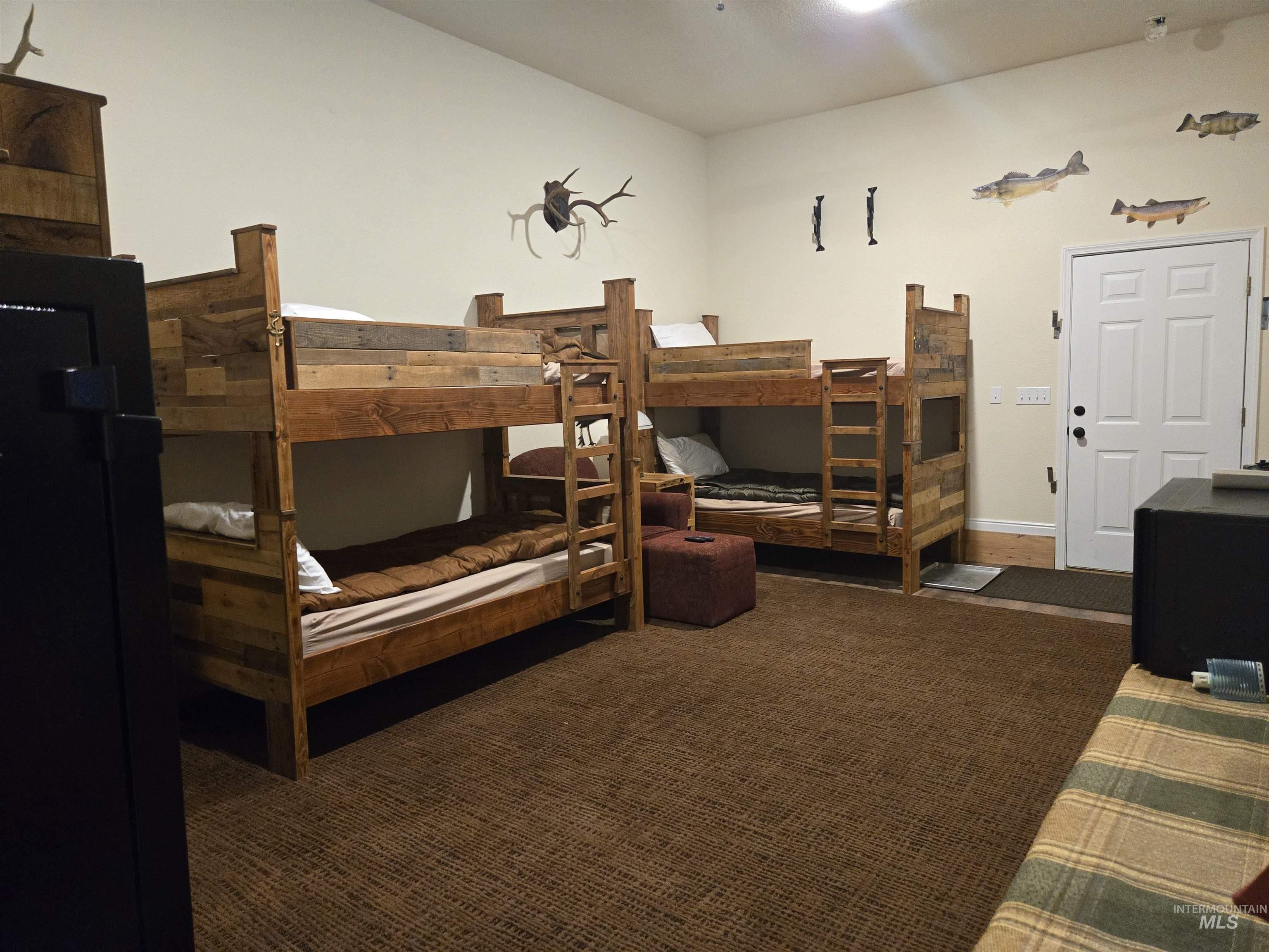 2141 Jackson Creek Road Council, ID 83612 - Photo 42 of 45 No guests? No problem. The bunkhouse transforms into a cozy private den just for you.