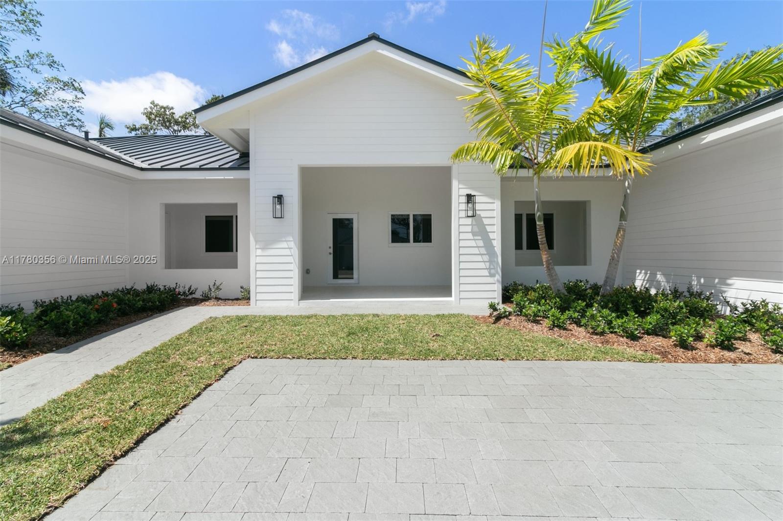 4729 Southwest 87th Court, Unit 4729 Miami, FL 33165 - Photo 3 of 14 a front view of a house with a yard