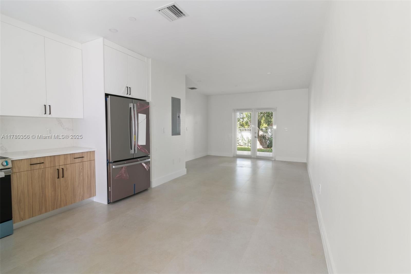 4729 Southwest 87th Court, Unit 4729 Miami, FL 33165 - Photo 5 of 14 a view of kitchen with a sink refrigerator and window