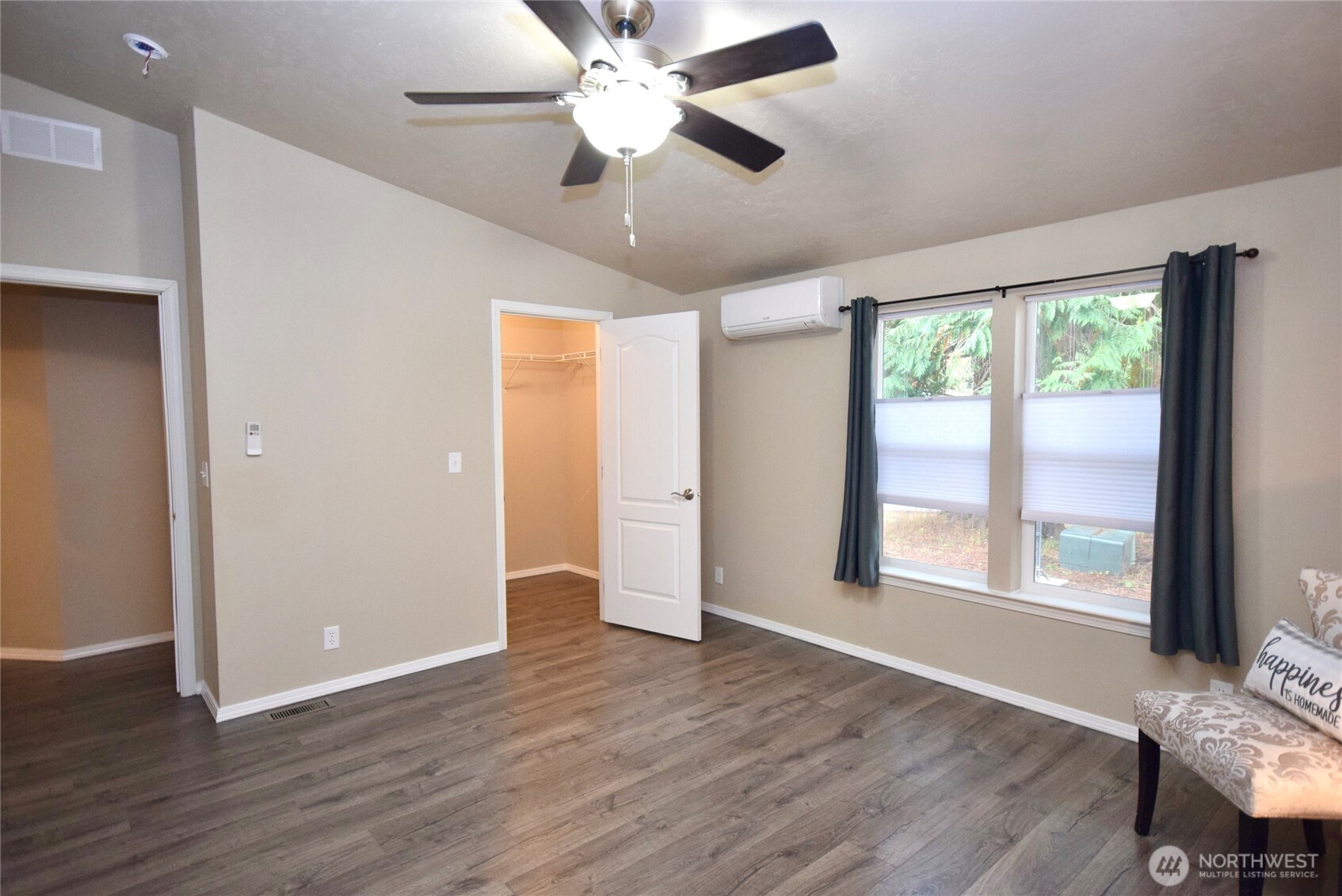 375 Dungeness Meadows Sequim, WA 98382 - Photo 18 of 27 an empty room with wooden floor and windows