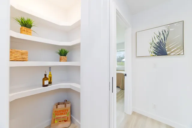 a view of hallway with window and toys