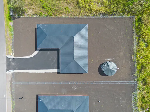 an aerial view of residential house with outdoor space