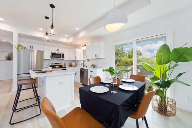 a kitchen with a table and chairs in it