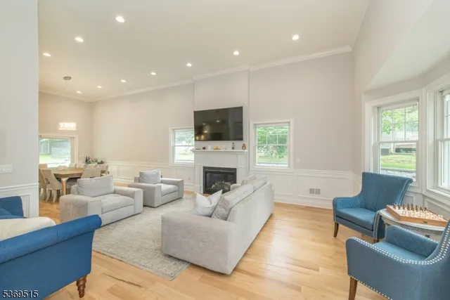 a living room with fireplace furniture and a flat screen tv