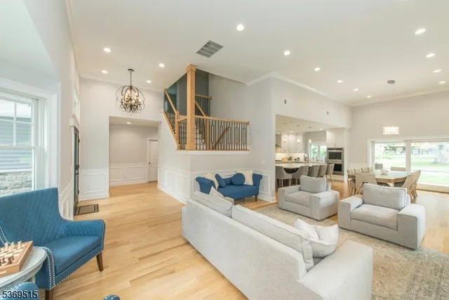 a living room with furniture kitchen view and a couch
