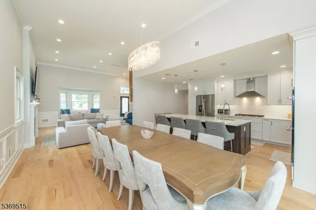 a large kitchen with a table and chairs