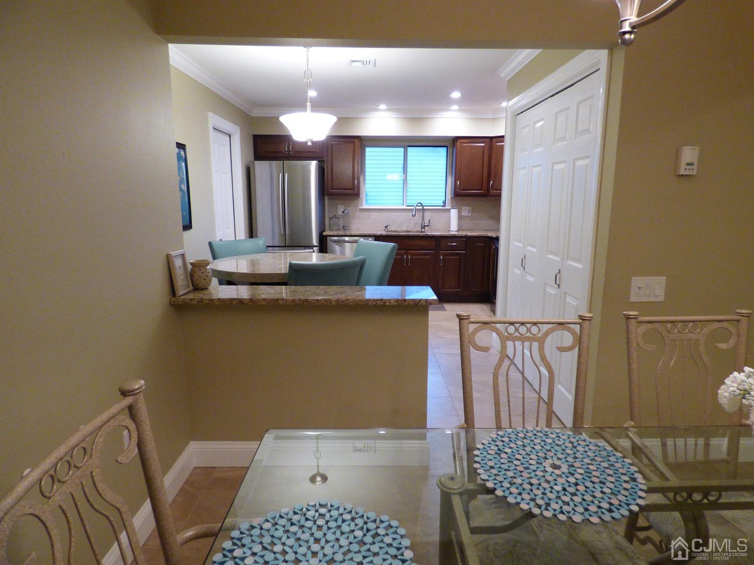 797B Sparta Road, Unit 797A Monroe Township, NJ 08831 - Photo 12 of 25 a bathroom with a sink a mirror and shower