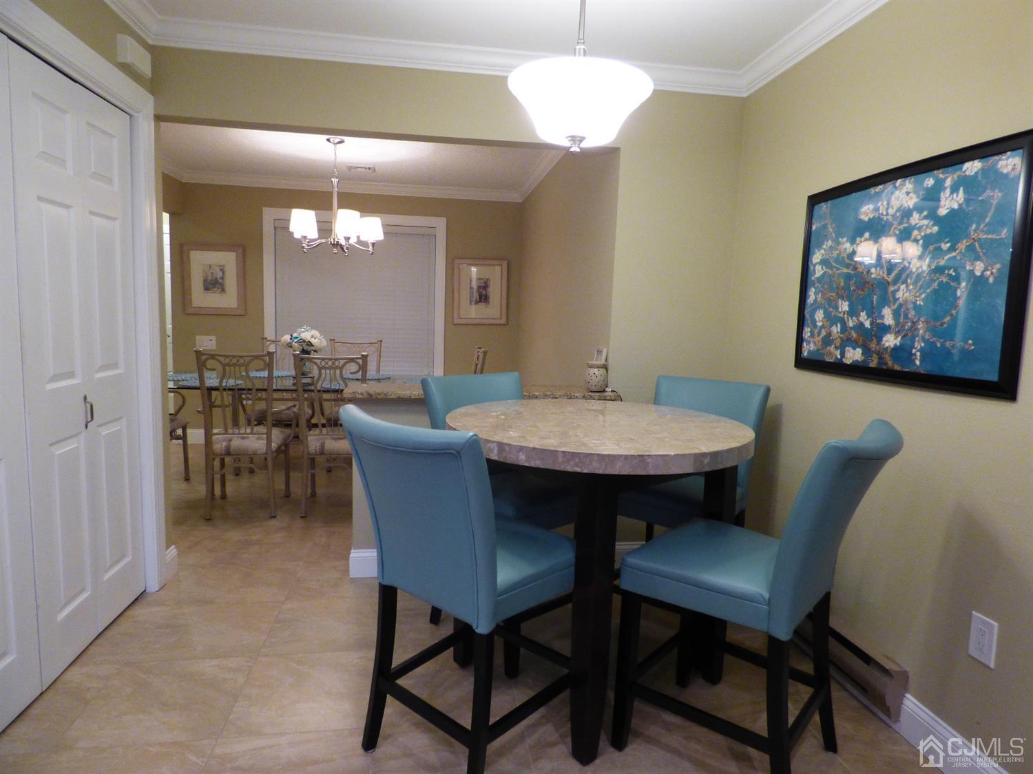797B Sparta Road, Unit 797A Monroe Township, NJ 08831 - Photo 16 of 25 a view of a dining room with furniture window and wooden floor