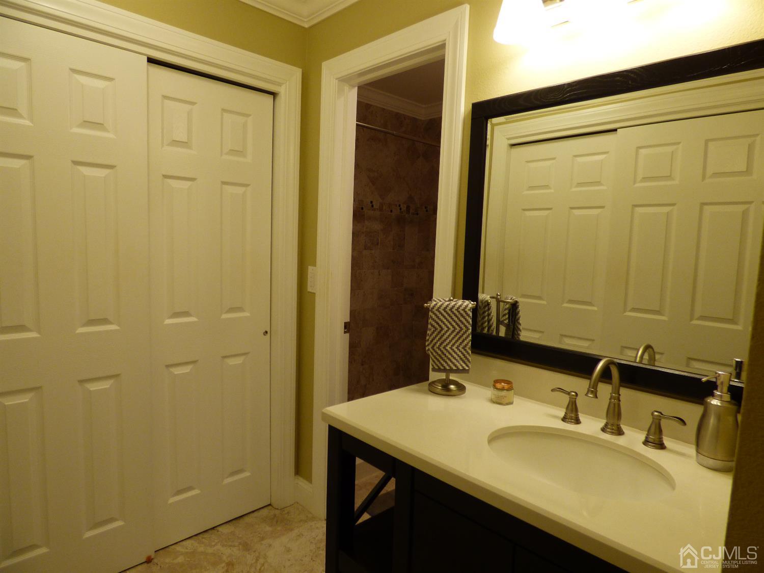 797B Sparta Road, Unit 797A Monroe Township, NJ 08831 - Photo 21 of 25 a bathroom with a sink and a mirror