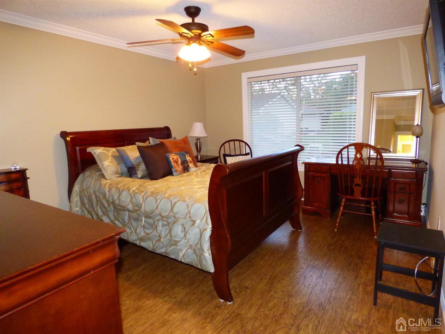 797B Sparta Road, Unit 797A Monroe Township, NJ 08831 - Photo 23 of 25 a bed room with a bed and a chair