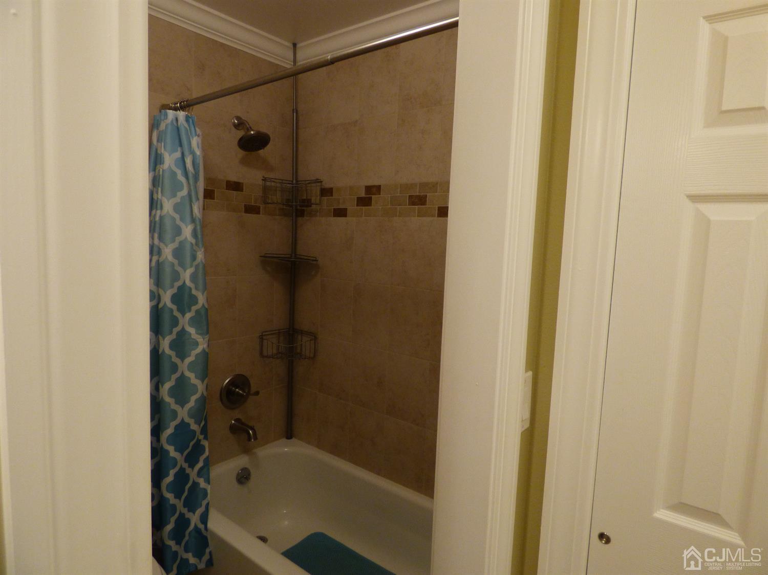 797B Sparta Road, Unit 797A Monroe Township, NJ 08831 - Photo 25 of 25 a bathroom with a shower and a bath tub