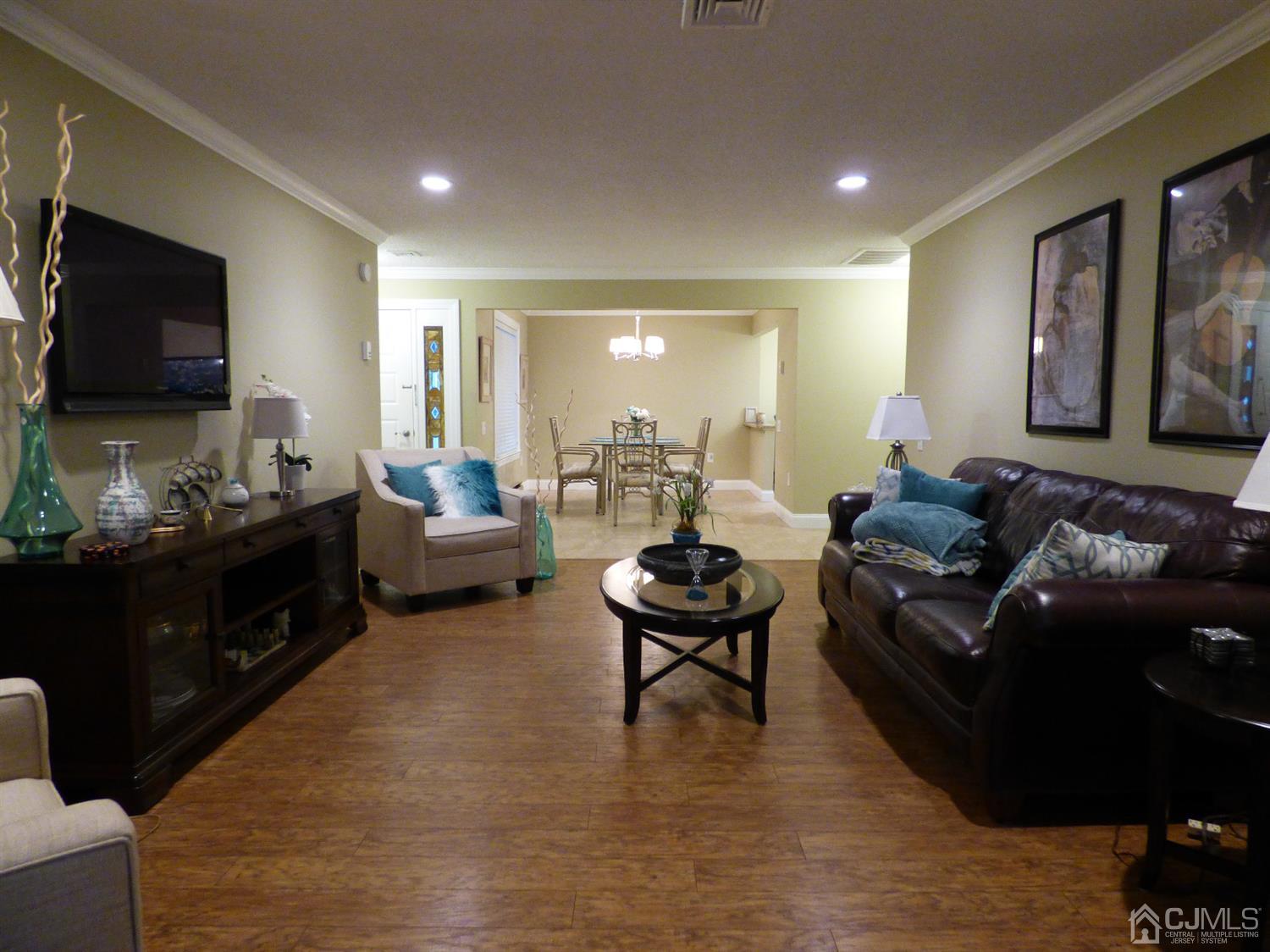 797B Sparta Road, Unit 797A Monroe Township, NJ 08831 - Photo 4 of 25 a living room with furniture and a flat screen tv