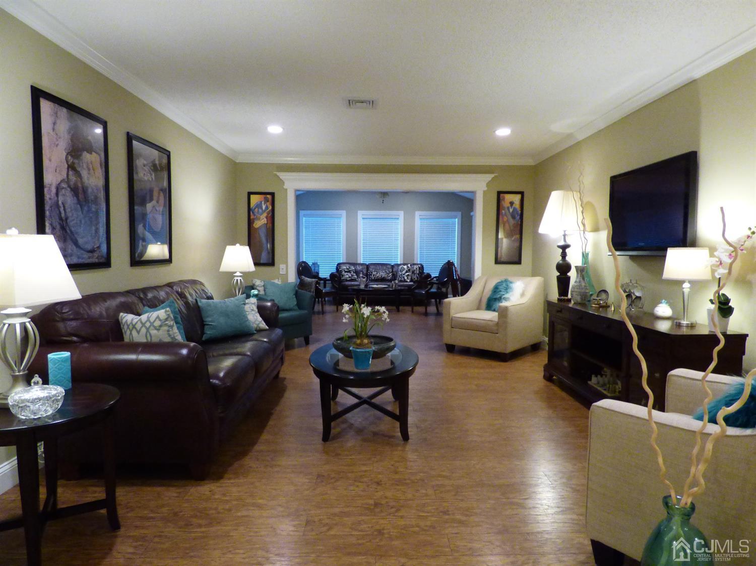 797B Sparta Road, Unit 797A Monroe Township, NJ 08831 - Photo 5 of 25 a living room with furniture and a flat screen tv
