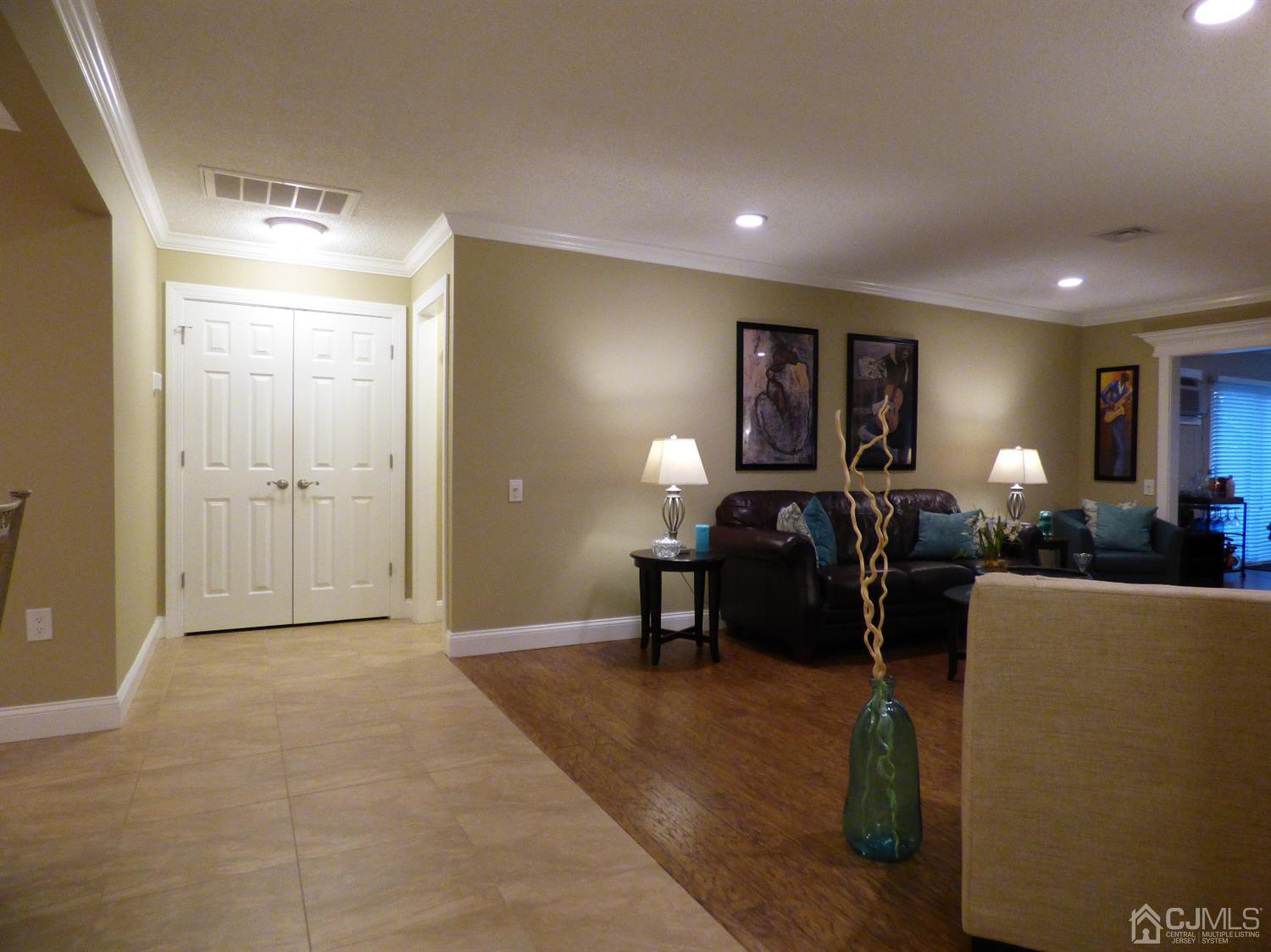 797B Sparta Road, Unit 797A Monroe Township, NJ 08831 - Photo 6 of 25 a living room with furniture a lamp and a window