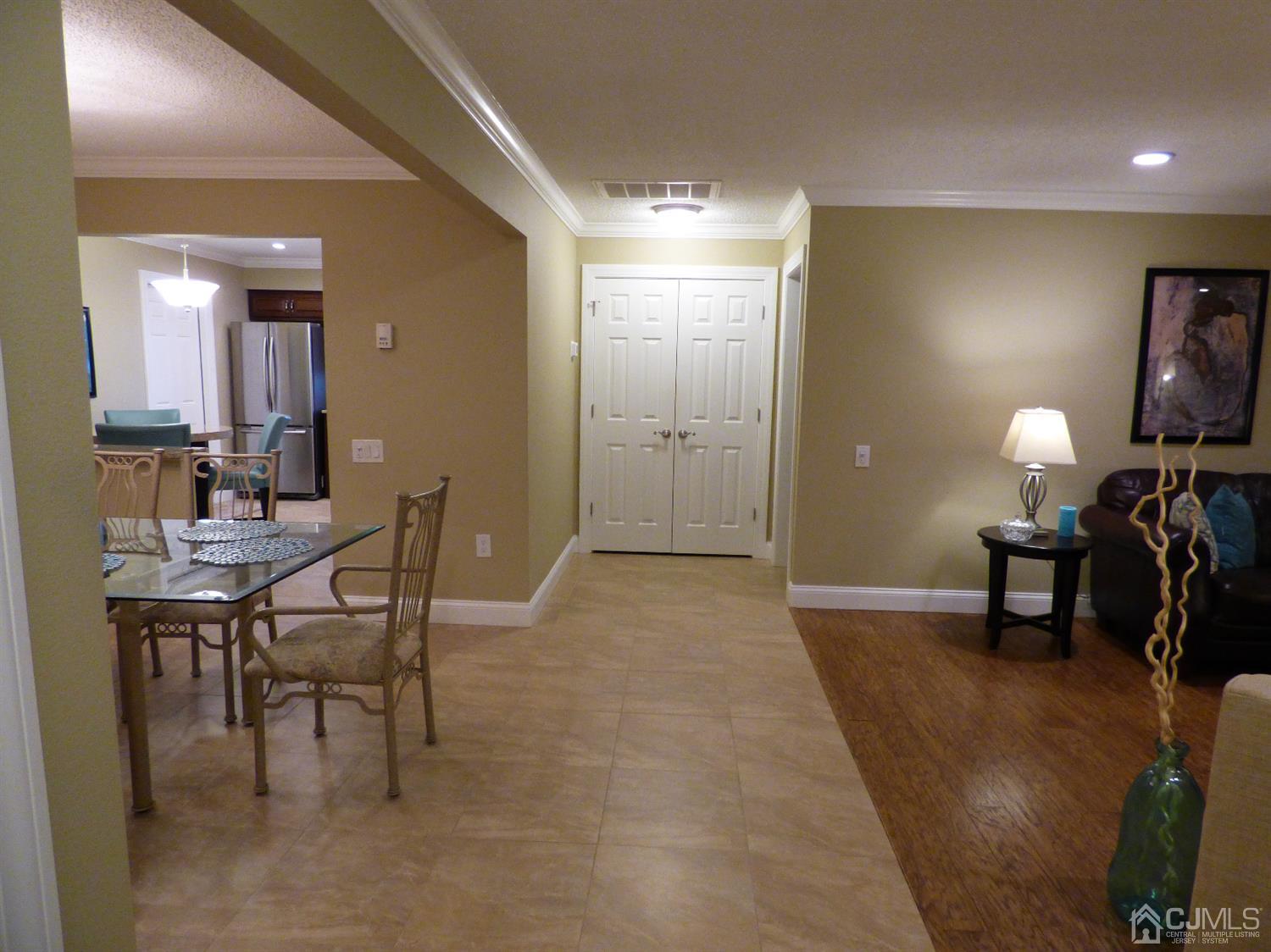 797B Sparta Road, Unit 797A Monroe Township, NJ 08831 - Photo 8 of 25 a view of a livingroom with furniture and a mirror