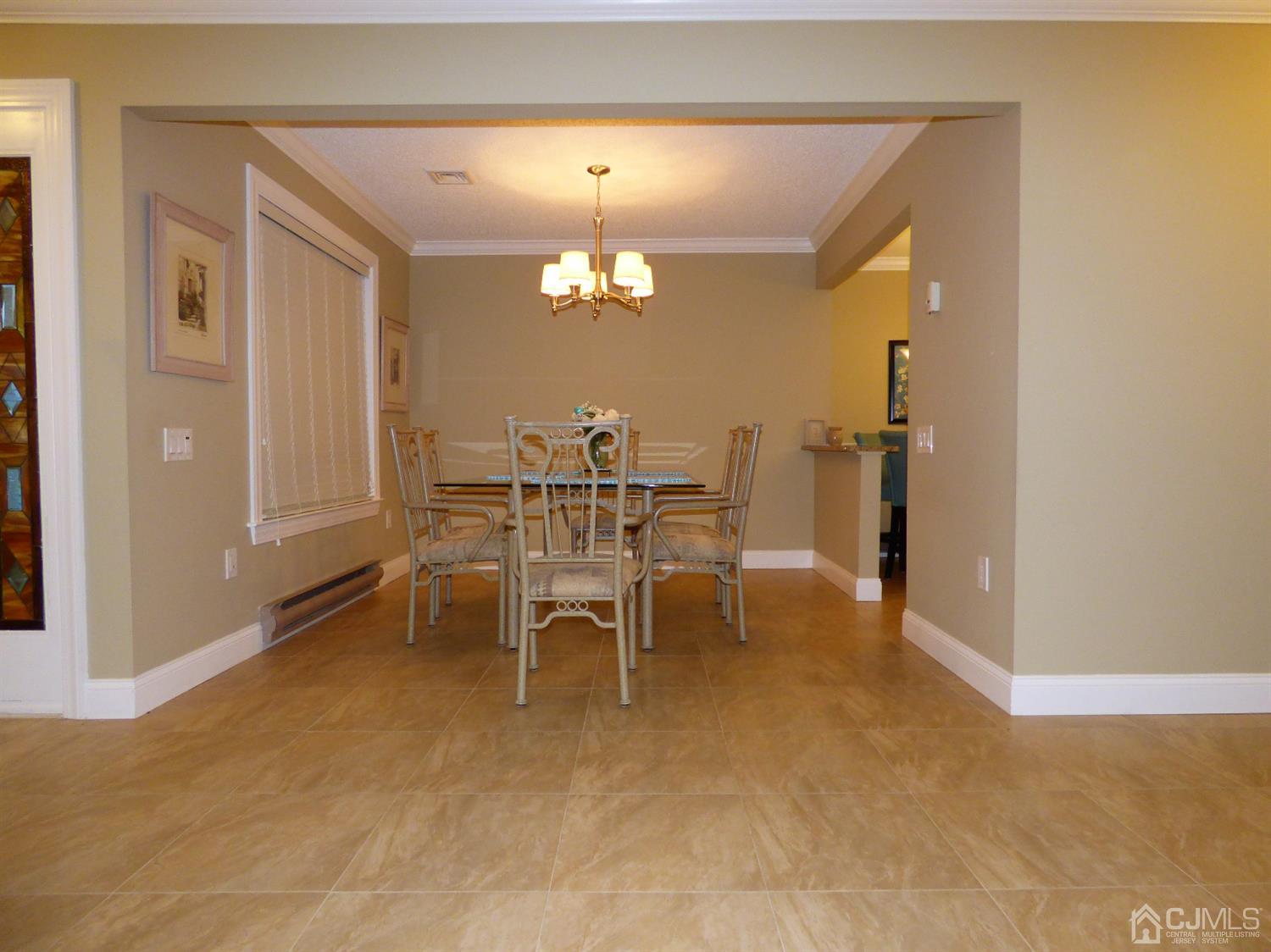 797B Sparta Road, Unit 797A Monroe Township, NJ 08831 - Photo 10 of 25 a dining room with furniture and chandelier