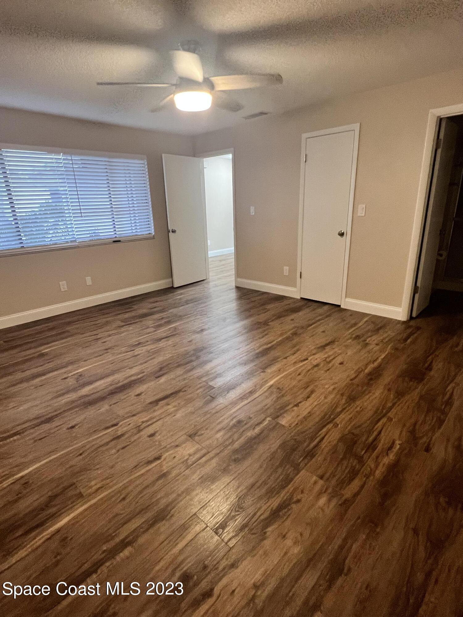 161 Augusta Way Melbourne, FL 32940 - Photo 20 of 26 a view of a room with wooden floor