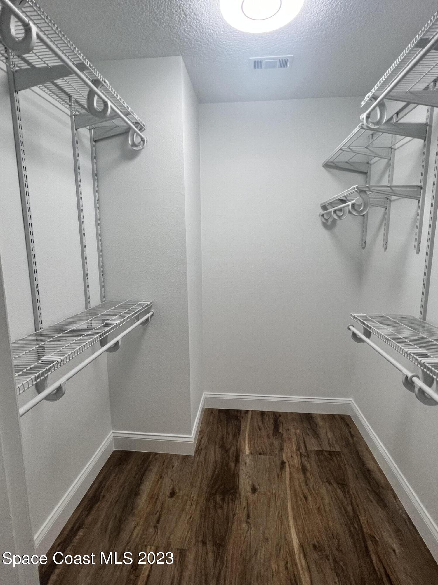 161 Augusta Way Melbourne, FL 32940 - Photo 22 of 26 a view of a room with racks on the wall