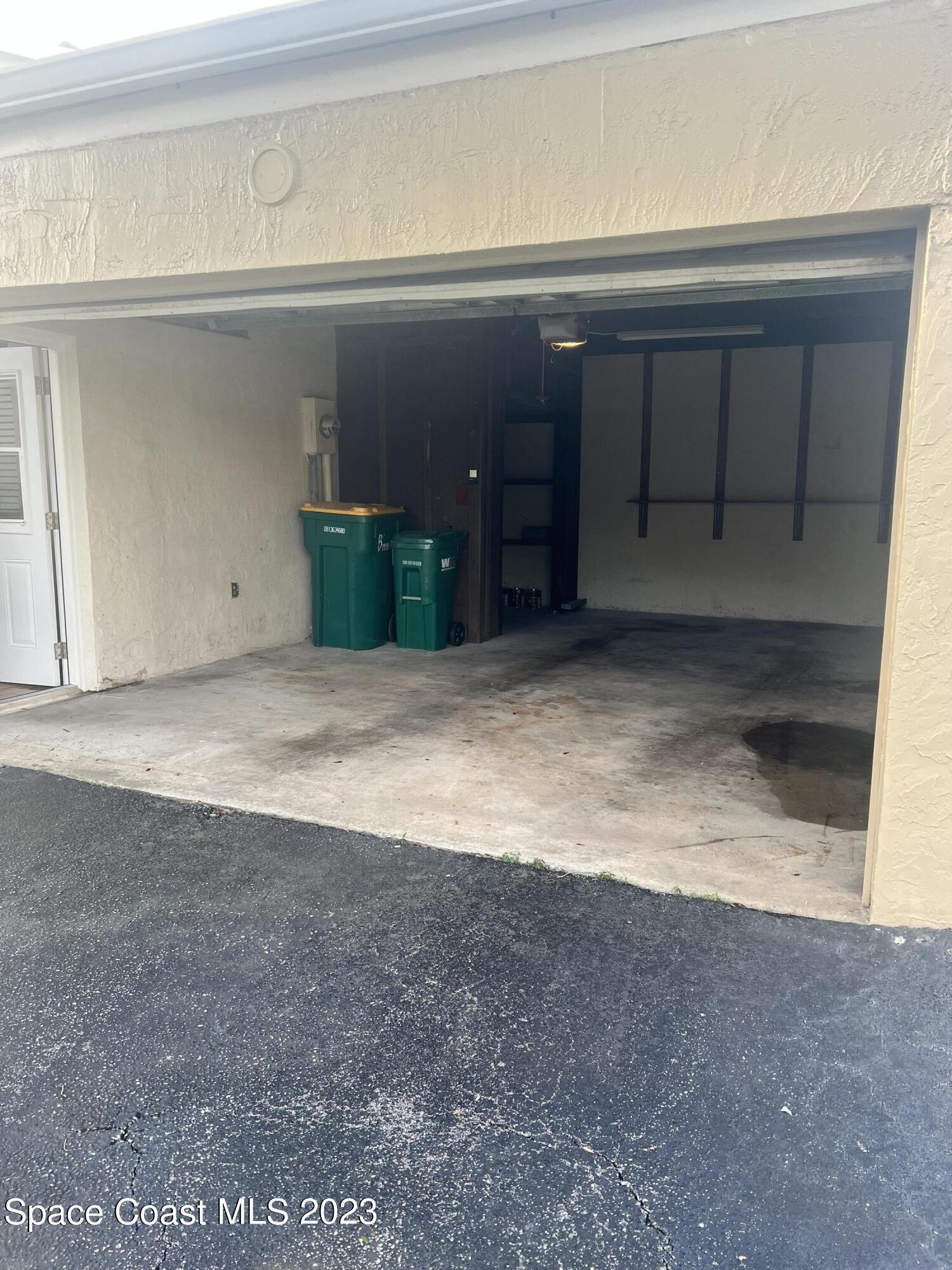 161 Augusta Way Melbourne, FL 32940 - Photo 3 of 26 a view of a car garage door