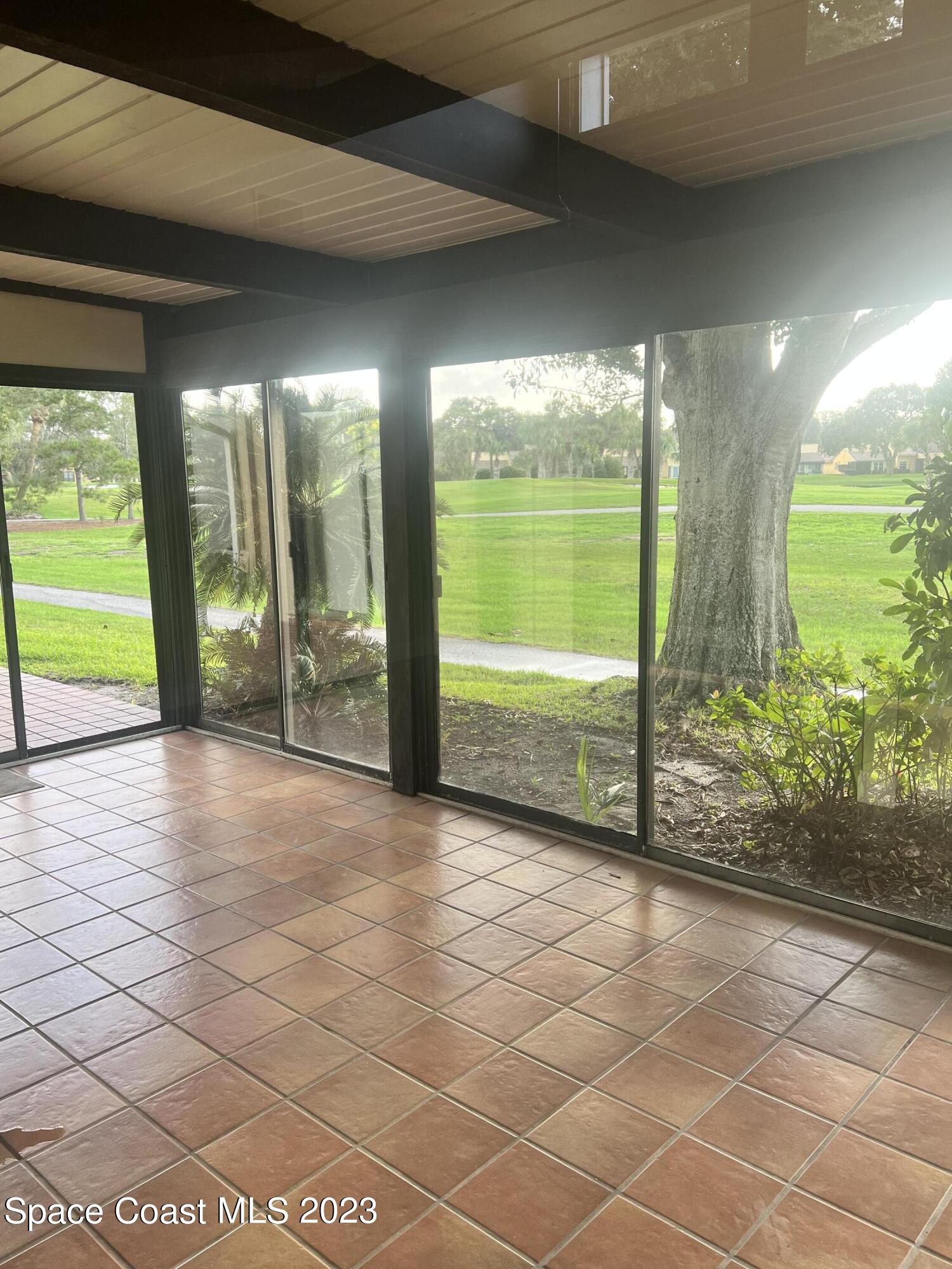 161 Augusta Way Melbourne, FL 32940 - Photo 10 of 26 a view of an empty room with a large window