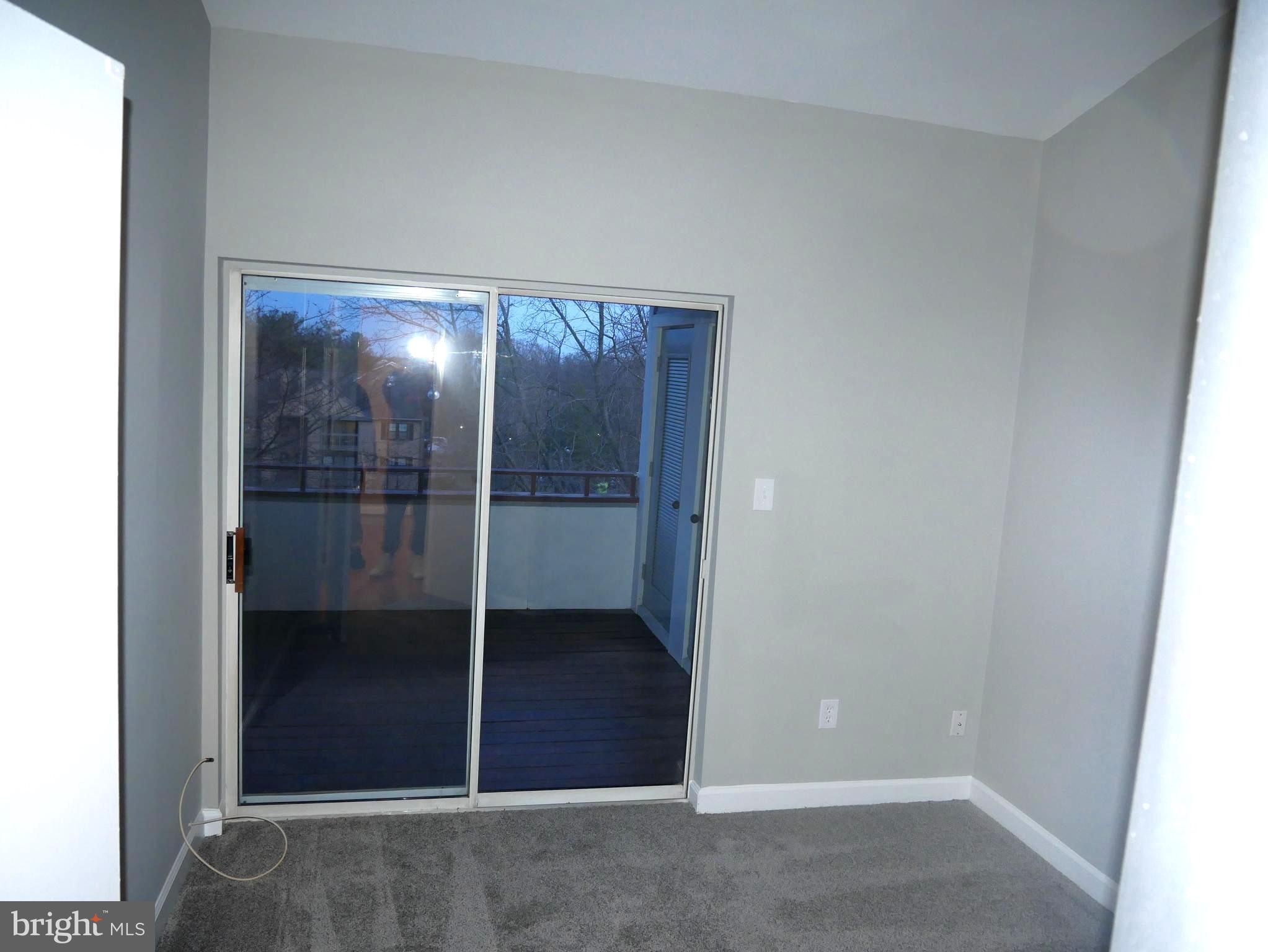 13611 Sir Thomas Way, Unit 1B33 Silver Spring, MD 20904 - Photo 22 of 26 Slider From Bedroom To Deck